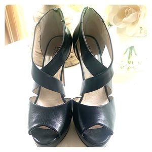 Black leather Michel Kors high heals.